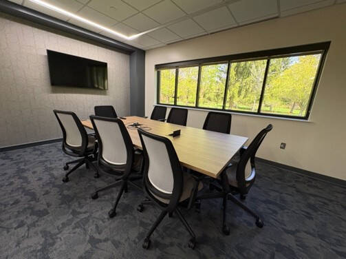 ASH 1202 conference room that has a large window